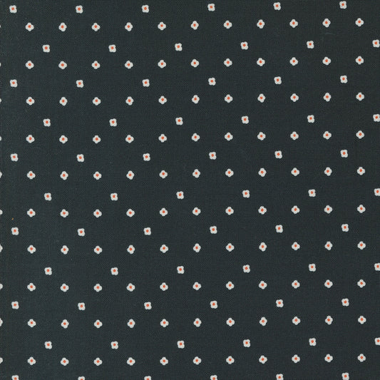 Dark fabric with small white floral pattern