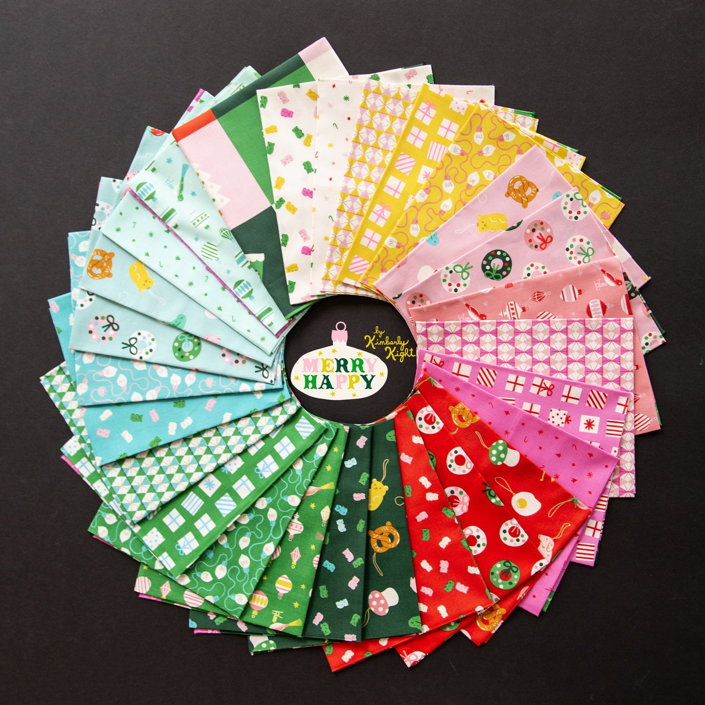 Collection of colorful fabric swatches from Ruby Star society merry happy arranged in a circular pattern on a black background.