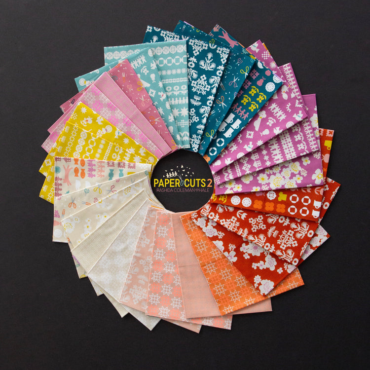Ruby Star Society Paper Cuts 2 Fabrics in peach, blue, purple, yellow and whiteon a black background