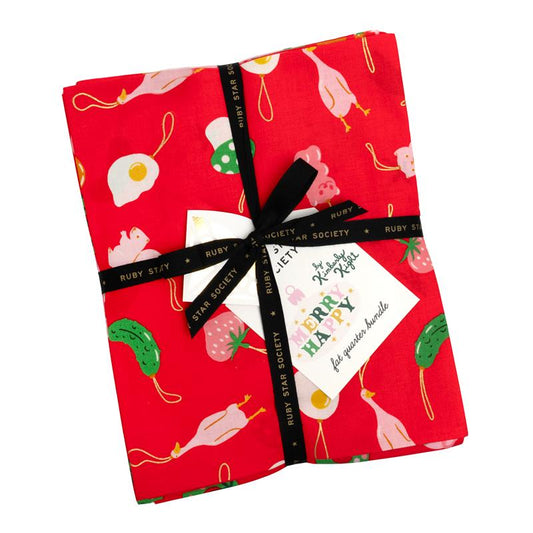 ruby star society merry happy fat quarter bundle with a red print on top with ornaments on a white background