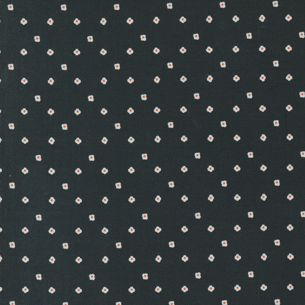 Dark fabric with small white floral pattern