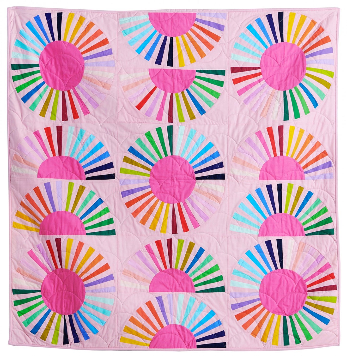 Mod daisy quilt kit a rainbow quilt on a pink background