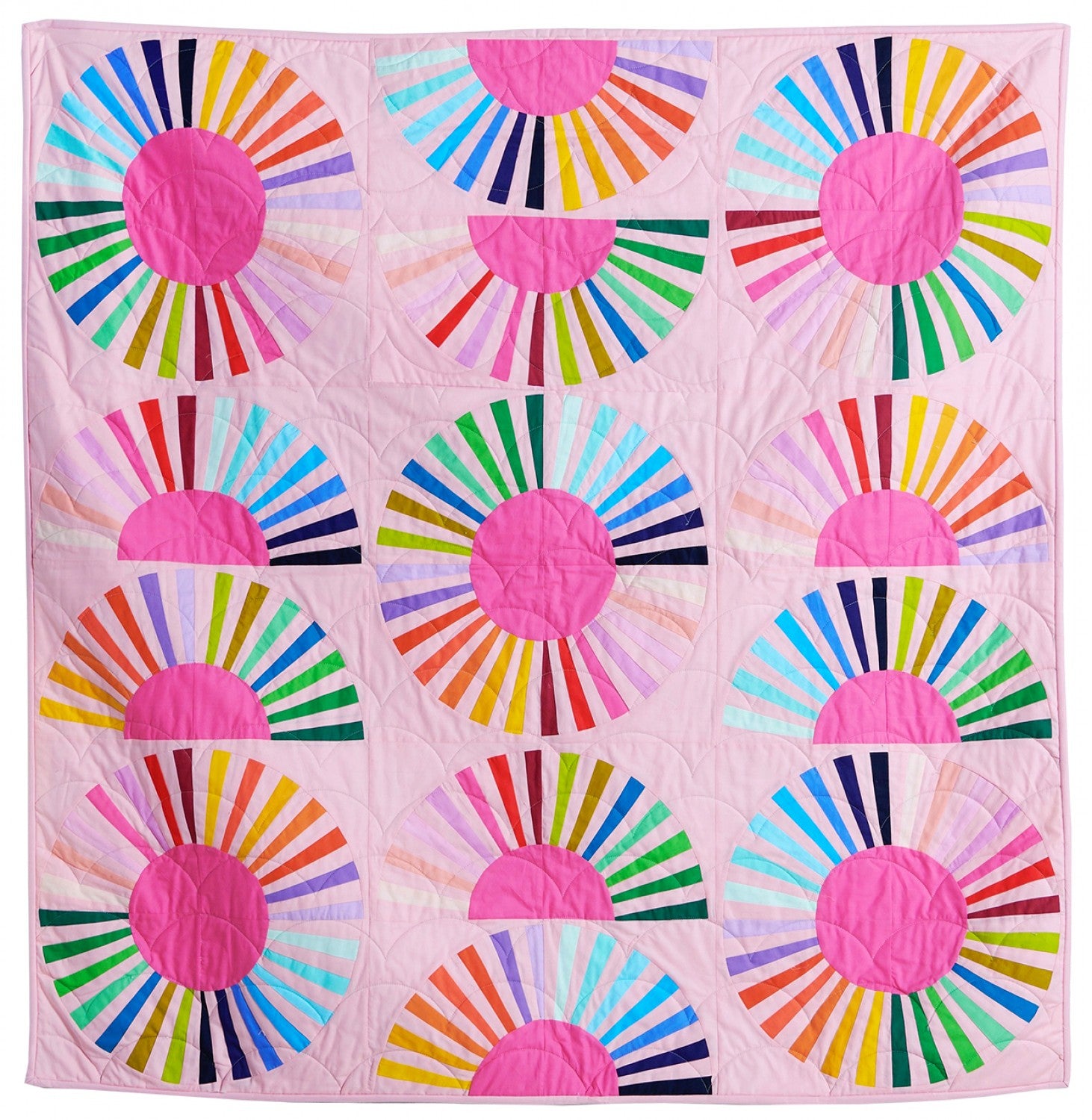 Mod daisy quilt kit a rainbow quilt on a pink background